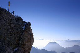 Man on the summit of the Zugspitze in the morning, Bavaria, Germany