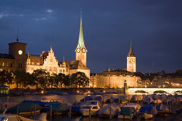 View over river Limmat to Fraumunster and St. Peter church at night, Zurich, Canton Zurich, Switzerland