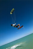 Man kiteboarding, big jump