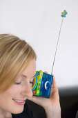 Young woman listening to portable radio