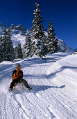 sledging at hut Lindauer Hütte, Rätikon range, Vorarlberg, Austria