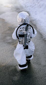 Boy wearing astronaut costume