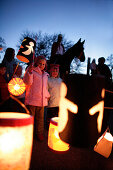 Children carrying lanterns for the St. Martin festival with St. Martin on a horse, Degerndorf, Upper Bavaria, Germany