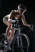 Female cyclist riding a bicycle