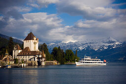 Boat arrivinig at Castle Oberhofen at Lake Thun, Oberhofen, Bernese Oberland (highlands), Canton of Bern, Switzerland