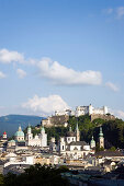 Panoramic view over Salzburg with Hohensalzburg Fortress, largest, fully-preserved fortress in central Europe, Salzburg Cathedral, Franciscan Church, St. Peter's Archabbey and Collegiate Church, built by Johann Bernhard Fischer von Erlach, Salzburg, Salzb