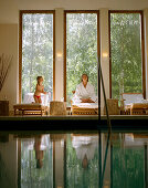 Woman with child at the pool, Badescheune, spa area of Seehotel Neuklostersee, Mecklenburg-Western Pomerania, Germany