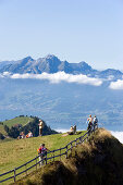Hikers on Rigi Kulm (1797 m) enjoying the view over Lake Lucerne to Pilatus (2132 m), Rigi Kulm, Canton of Schwyz, Switzerland