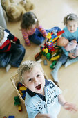 Children playing with plastic bricks