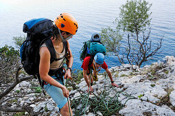 Two young people climbing, Il Sentiero Selvaggio Blu, Golfo di Orosei, Sardinia, Italy, MR