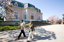 Mature adult couple walking hand in hand at Benrath castle, Düsseldorf, state capital of NRW, North-Rhine-Westphalia, Germany