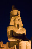 An illuminated statue at Luxor Temple, Luxor, Egypt