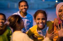 Four girls, friends, having fun together, dusk, Luxor, Egypt