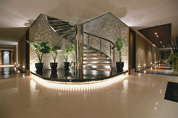 Corridor and spiral staircase, stairs inside Hotel Banyan Tree Spa, Bangkok, Thailand