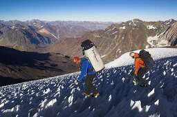 Two men descending over the ice fields of Cerro Mermolejo, 6085m, Ice Climbing, Chile