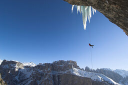 Ice climber rappelling, Langental valley, Dolomites, Trentino-Alto Adige, Italy