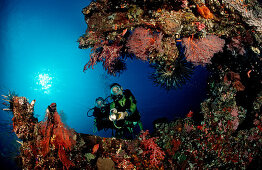 Two Scuba diver examine ship wreck Liberty, Bali, Tulamben, Indian Ocean, Indonesia