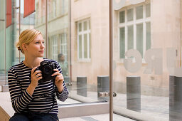 Museum of the city of Luxembourg, woman holding camera