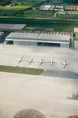 Five airplanes parking in a row at the airport, Munich, Bavaria, Germany