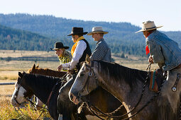 cowgirl and cowboys sitting on horses, wildwest, Oregon, USA