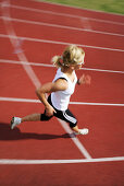 Woman runner on cinder track, , Carinthia, Austria