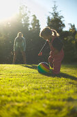 Mother and daughter playing ball, Braunlange, Harz mountains, Lower Saxony, Germany