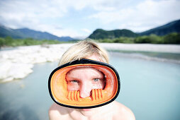 Young woman wearing diving goggles, Fussen, Bavaria, Germany