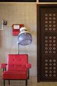 Red Chair and Coin-Operated Hair Dryer at Gellert Baths, Buda, Budapest, Hungary