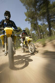 People driving offroad with motocross motorbikes, Suzuki Offroad Camp, Valencia, Spain