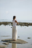 Woman doing Yoga exercises on the beach, Wellness, Relaxation, Health, Thailand