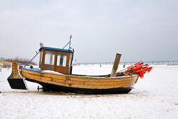 Fishing boat at beach in winter, Ahlbeck, Usedom Island, Mecklenburg-Western Pomerania, Germany