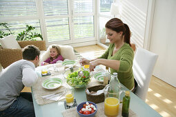 Young family having lunch, Munich, Germany