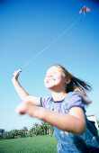 Girl flying kite