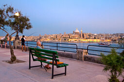 People at the promenade in the evening, view at the town Valletta, Sliema, Malta, Europe
