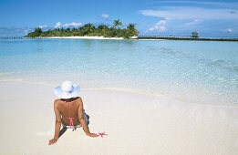 Woman on the beach in White Sands Resort and Spa. Ari Atoll. Maldives