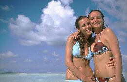 Women on the beach in Ari Atoll. Maldives