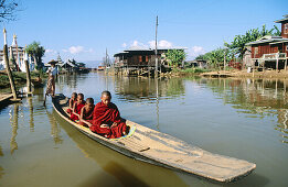 Monk on boat for alms. Inle Lake. Shan State. Myanmar.