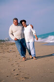 Mature couple walking at the beach. Florida. USA