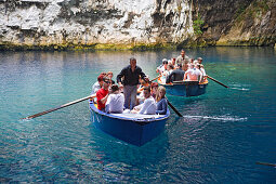 Cephalonia, tourists driving in boats in front of Melissani cave in Sami, Ionian Islands, Greece