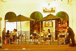 People at the terrace of Cafe Puerto Rico at night, San Juan, Puerto Rico, Carribean, America