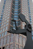 Sculpture of a man hammering in front of the Messeturm, Trade Fair Tower, (Artist: Jonathan Borofsky), Frankfurt, Hesse, Germany