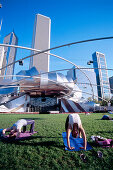 Gymnastics before Jay Pritzker Pavillon of Frank Gehry at Millenium Park, Chicago, Illinois, USA