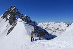 young woman backcountry skiing in Noppenkar, Allgaeu range, Allgaeu, Tyrol, Austria