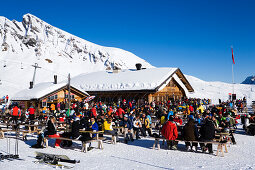 Skiers resting at mountain restaurant Schreckfeld, First, Grindelwald, Bernese Oberland, Canton of Bern, Switzerland