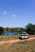 Safari bus on the way in Taita Hills Game Reserve, Coast, Kenya