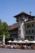 People sitting in a pavement cafe at Baerenplatz, Old Town of Berne, Berne, Switzerland