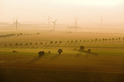 aerial of wind turbines in evening light, Lower Saxony, northern Germany