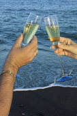 Toasting with champagne on the beach