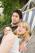Young couple lying in hammock