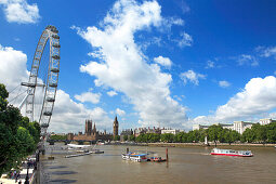 Das London Eye und Houses of Parliament an der Themse, London, England, Großbritannien